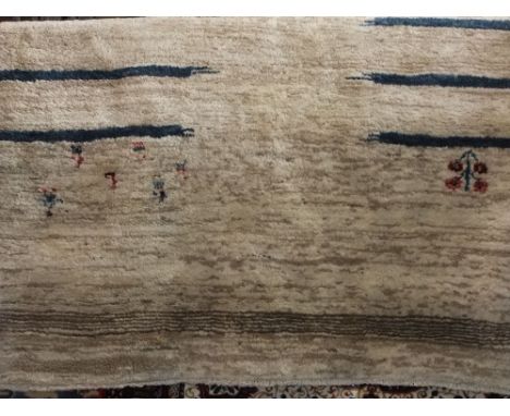 A heavy contemporary wool carpet with sparse character detail on a bark coloured ground, 290 cm x 195 cm approx