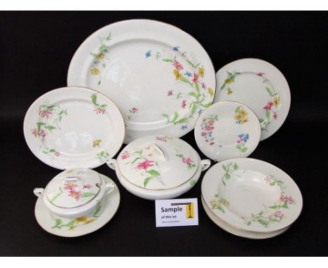 A quantity of early 20th century Royal Worcester dinner wares with printed and infilled floral sprays including honeysuckle, 