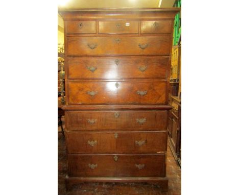 A Georgian walnut and figured walnut chest on chest of six long and three short drawers, with herring bone banding, oak lined
