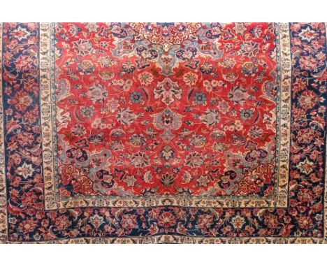 Good quality heavy wool Persian style carpet, the central blue ground medallion upon a red field within alternating running b