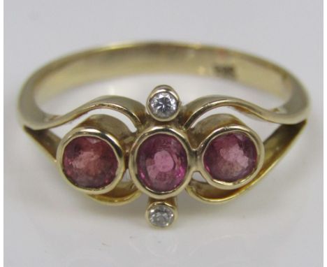 A 14ct pink ruby and diamond ring of stylised form, size L, 2.7g