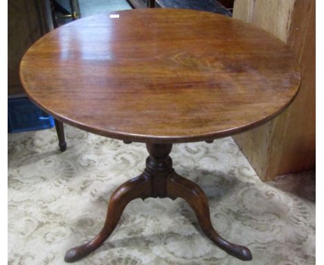 A Georgian mahogany occasional table of circular form raised on a turned vase shaped pillar and swept tripod, 80 cm diameter 