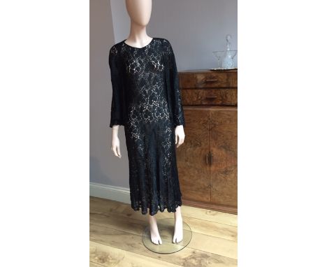 Two full length 1930s evening dresses, both sleeveless, one with sheer black lace and sequinned V shaped neckline and other i