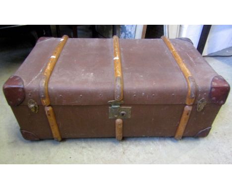 A vintage brown fibre timber lathe and leather reinforced cabin trunk with oval label guaranteed flaxite fibre featherweight 