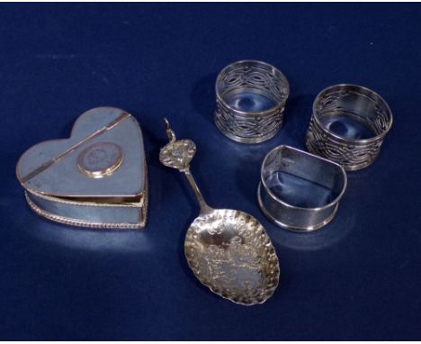 Mixed collection of silver to include three napkin rings and a Dutch white metal novelty spoon embossed with figures, 2.5 oz,