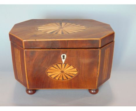 19th century flame mahogany and box wood inlaid tea caddy of octagonal form, the hinged lid enclosing a fitted interior upon 