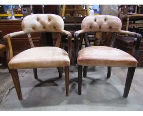 A pair of reproduction Georgian style open armchairs with pale tan leather upholstered seat, button back and arms and within 