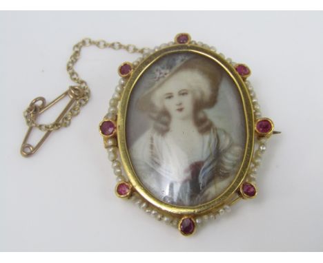 A gold brooch containing a painted miniature portrait, mount set with seed pearls and pink rubies