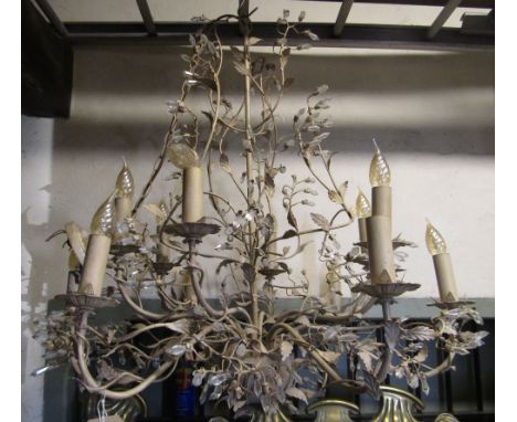 A contemporary painted cast light metal hanging ceiling light with naturalistic scrolling branches, leaf and simulated flower