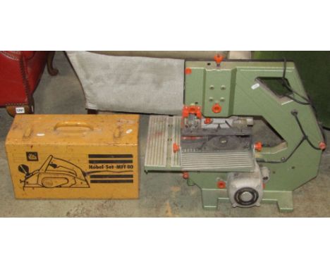 A Dewalt bench top band saw model number DW100, a metal cased Elu Hobel set MFF80 electric planer