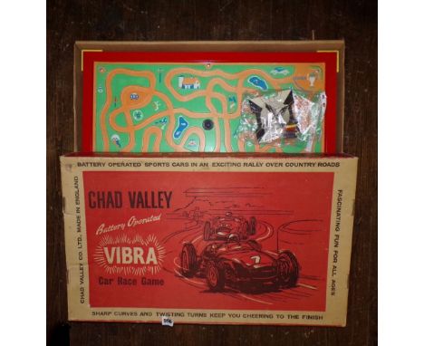 A Chad Valley Vibra car race game, battery operated sports car, rallying over country roads with original box