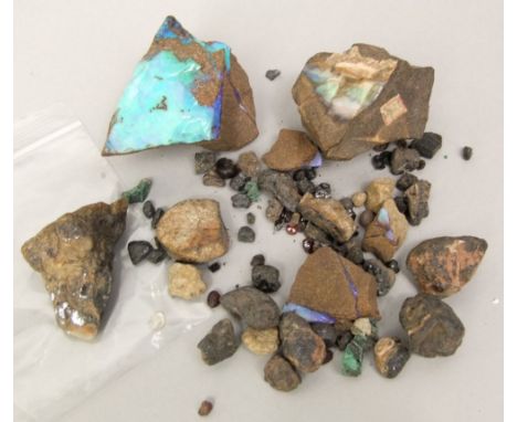 Four pieces of rough hewn stone containing deposits of opal and further ancient stones