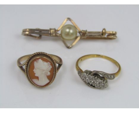 An 18ct three stone diamond ring, size K/L, together with a 9ct cameo ring depicting a lady, size J; 5.1g total, etc (3)