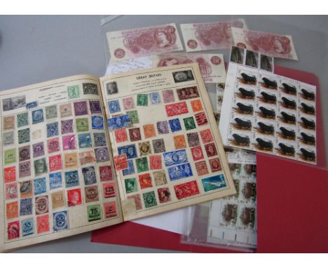 An album containing British &amp; Worldwide stamps, a collection of mint stamps, four 10 shilling notes, and a Falklands Firs