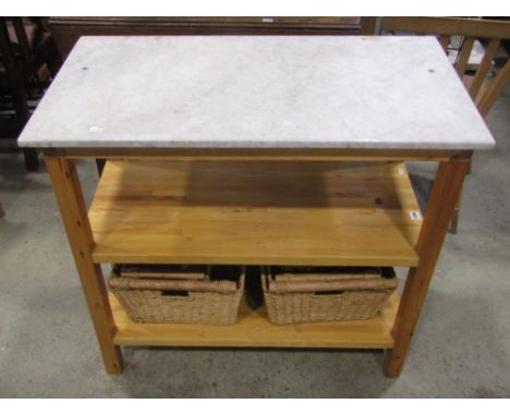 A stripped pine and beechwood kitchen work/serving table of rectangular form with white and grey flecked rectangular marble t