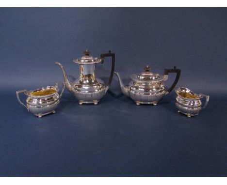 Late Victorian silver four piece boat shaped half fluted tea service, comprising tea pot, water pot, milk jug and sucrier, ma