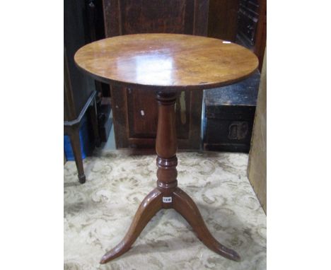 A 19th century mahogany snap top occasional table of circular form raised on a central turned pillar and shaped tripod