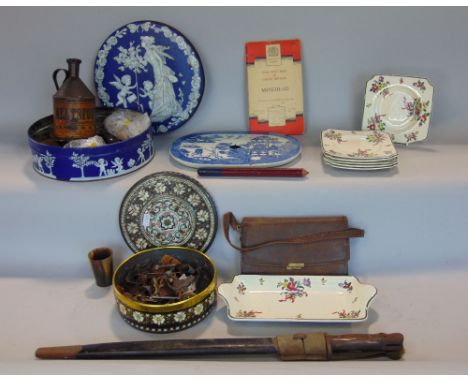A box of interesting items to include a 1907 bayonet, vintage tins, an oversized pencil, a Neats Foot Oil canister, button co