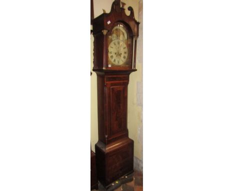 A Georgian longcase clock, cross banded within rosewood and further string inlaid detail, the hood with reeded columns suppor