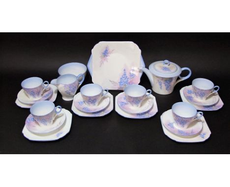 A six place Shelley art deco tea service with blue wisteria type decoration comprising tea pot, milk jug, sugar bowl, cake pl