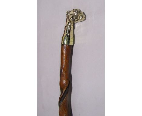 Interesting twisted walking stick with cast metal dog head finial