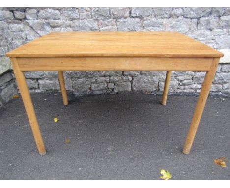 A small light elm and beechwood cottage dining table (probably Ercol) of rectangular form raised on four simple turned legs, 