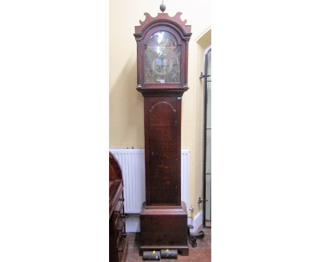 A Georgian oak longcase clock, the trunk enclosing a full length arched door, the hood with arched outline and wavy moulded d