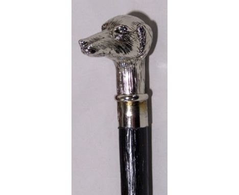 Ebonised walking stick with cast white metal dog head finial