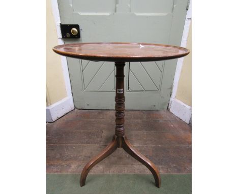 A simple Georgian mahogany occasional table, the circular dished top 56cm diameter, raised on a slender turned column and ree