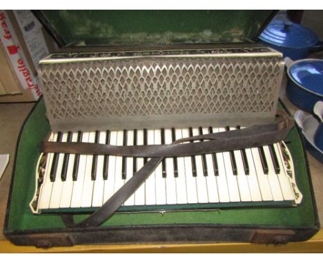 A cased Hohner Verdi III piano accordion
