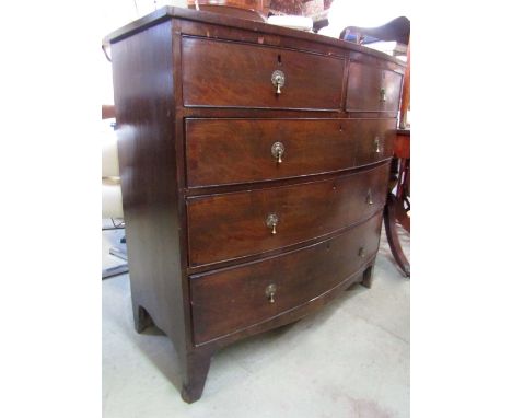 A 19th century mahogany bow fronted bedroom chest of three long and two short drawers with shaped apron and bracket supports,