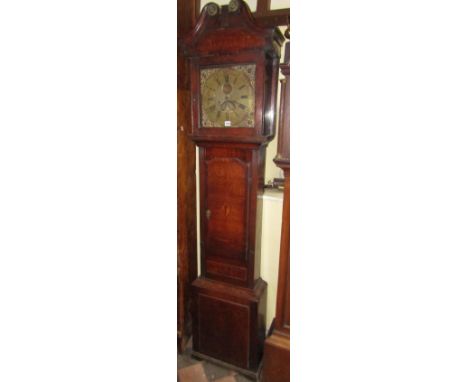 A Georgian oak longcase clock, the shaped door cross banded in walnut, the square cut hood set beneath swan necked cornice, e