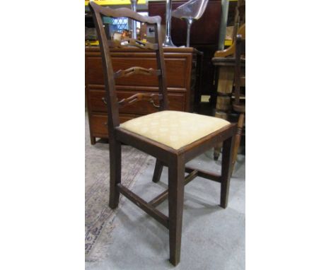 A set of six Edwardian mahogany dining chairs, loosely in the Chippendale style with pierced and shaped ladder-backs over dro