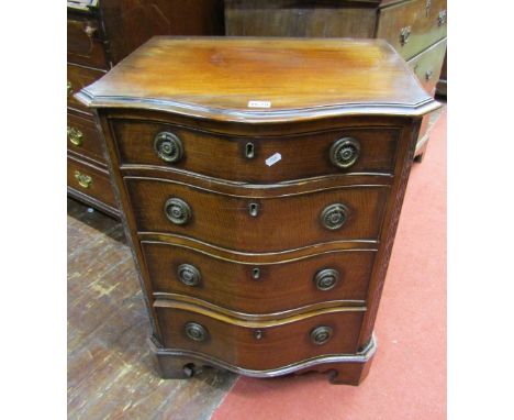 An Edwardian mahogany chest of serpentine form in the Georgian manner, with brass ring handles, the canted corners with blind