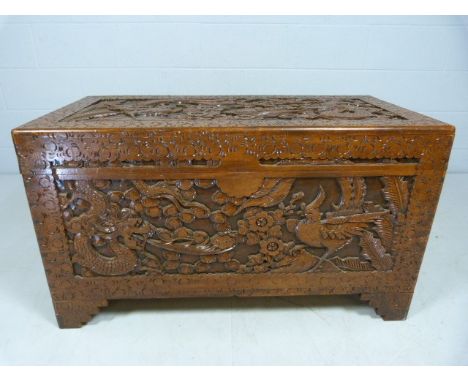 Heavily carved hardwood trunk