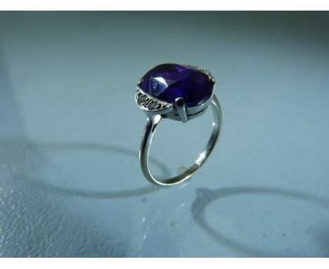 9ct White Gold art deco style ring set with large Royal purple Amethyst and with shoulders of a crescent shape each with two 
