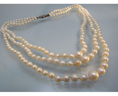 3 string graduated Cultured pearl necklace with silver Marcasite clasp. Shortest Row approx 16.5inch. The pearls range from a