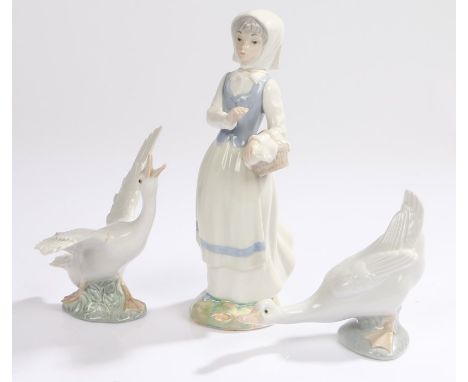 Three porcelain figures, consisting of Lladro and Nao birds and a Lladro style figure of a lady (3)