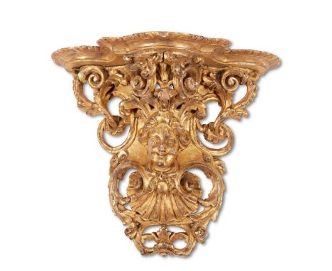 A RÉGENCE CARVED GILTWOOD WALL BRACKETCIRCA 1720The lobed and gadrooned top above an elaborately carved and pierced supports 