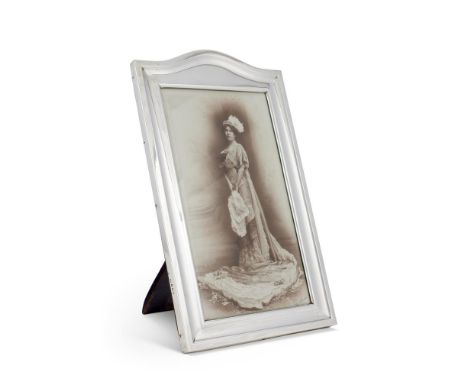 A LARGE SILVER ARCH TOP RECTANGULAR PHOTOGRAPH FRAMEWith a black and white portrait photograph of Mary, Marchioness of AilsaC