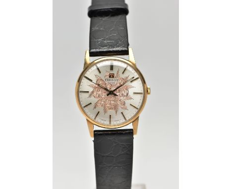 A 9CT YELLOW GOLD TISSOT WRISTWATCH, the silver coloured dial, with black enamel and gilt hourly applied markers, dial signed