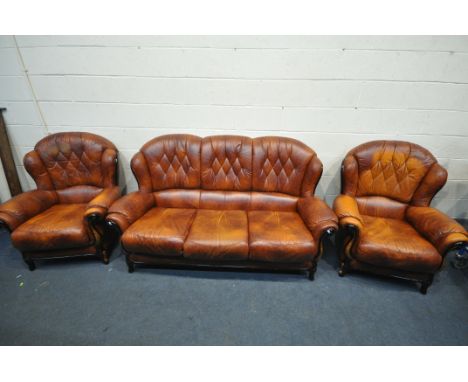 A BROWN LEATHER THREE PIECE LOUNGE SUITE, comprising a three seater sofa and a pair of armchairs (condition:-all with some fa