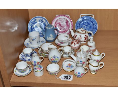 A COLLECTION OF ASSORTED MINIATURE TEAWARES, comprising a Wedgwood blue Jasper Ware coffee pot, a Coalport red 'Indian Tree' 