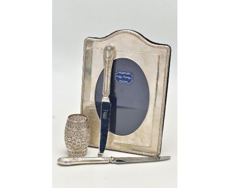 A SILVER PHOTO FRAME, A SUGAR CASTER AND TWO TEA KNIVES, the polished frame with beaded rim, hallmarked London, together with