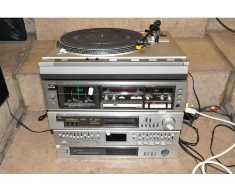 A VINTAGE TEAC COMPONANT HI FI  comprising of a TT-2 Audio Program Timer, a EQA-20 Graphic Equaliser, a T70 Tuner, a V-4RX Ca
