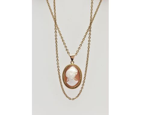 A YELLOW METAL CAMEO PENDANT NECKLACE, the pendant of an oval form, set with a carved shell cameo depicting a lady in profile