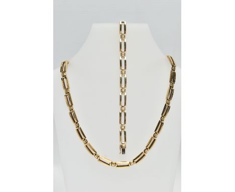 A 9CT YELLOW GOLD NECKLACE AND BRACELET SET, each designed as a series of plain polished rectangular split links with grooved
