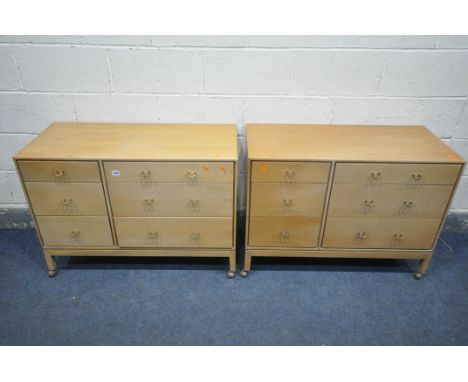 A PAIR OF MID CENTURY LIGHT OAK STAG CHEST OF SIX ASSORTED DRAWERS, on plastic casters, width 97cm x depth 46cm x height 70cm