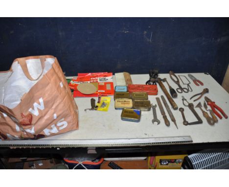 A BAG CONTAINING A VARIETY OF TOOLS, including hammers, trowels, pliers, etc., various sized sanding sheets, six vintage toba