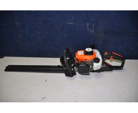 A VIDAXL.COM PETROL HEDGE TRIMMER with 22in cut ( engine pulls freely but hasn't started)
